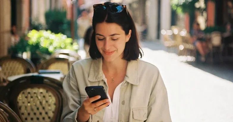 Traveler reviewing trip spending on their phone