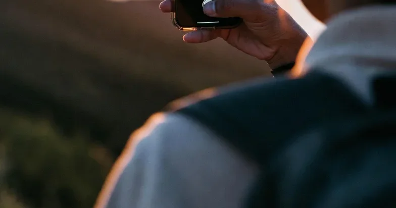 Traveler capturing and organizing photos from a trip on their phone