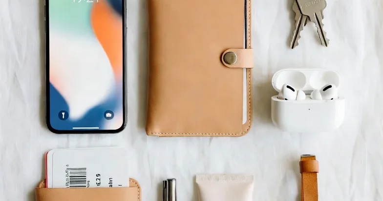 Traveler organizing luggage and bookings before an international trip